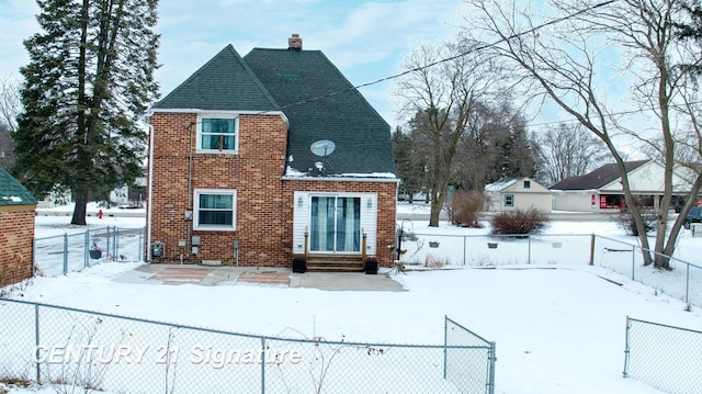 view of snow covered property