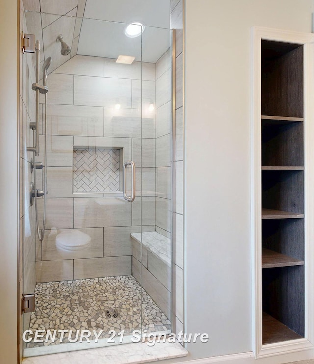 bathroom featuring an enclosed shower