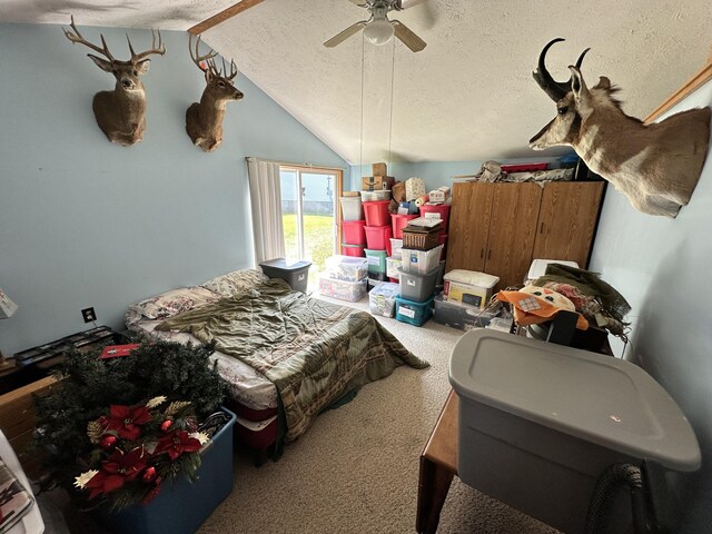 2717 N Sherman Rd, Ludington, MI 49431 - bedroom with a textured ceiling, carpet floors, lofted ceiling, and a ceiling fan