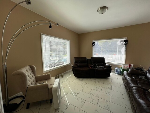 11642 Cascade St, Detroit, MI 48204 - living room featuring light marble finish flooring and baseboards