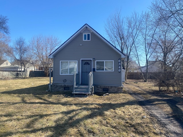 6346 Stahelin Ave, Detroit, MI 48228 - view of front facade with crawl space, a front yard, and fence