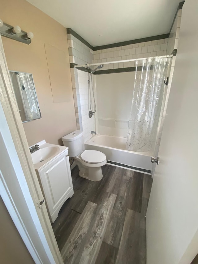 6346 Stahelin Ave, Detroit, MI 48228 - full bathroom featuring vanity, toilet, wood finished floors, and shower / bath combo