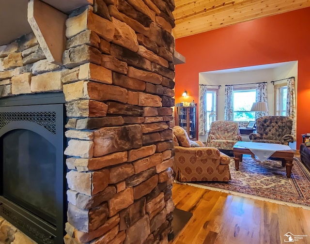 living room featuring hardwood / wood-style flooring and wooden ceiling