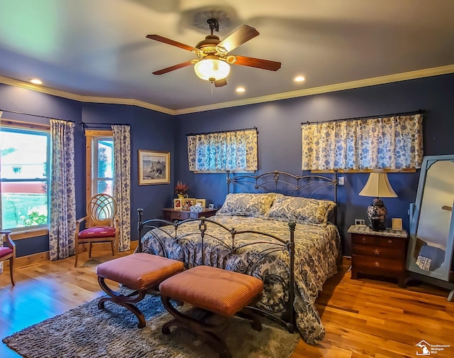 bedroom featuring ceiling fan, crown molding, and light wood-type flooring