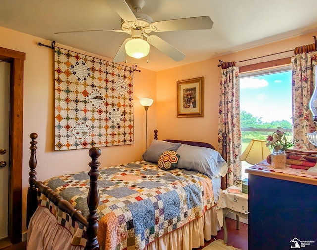 bedroom featuring ceiling fan and hardwood / wood-style floors