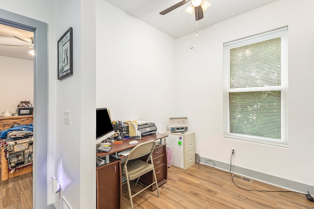 office space with light wood-type flooring