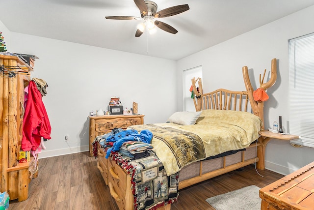 bedroom featuring dark hardwood / wood-style floors and ceiling fan