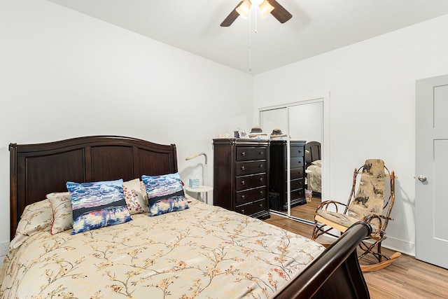 bedroom with light hardwood / wood-style floors and ceiling fan