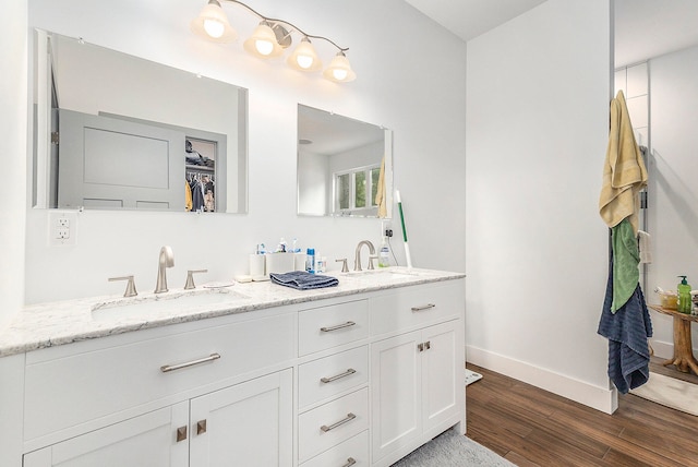 bathroom with vanity and hardwood / wood-style flooring