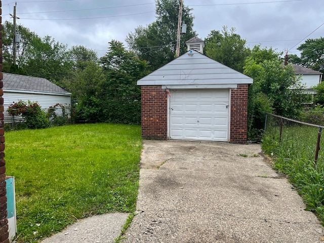 garage featuring a yard