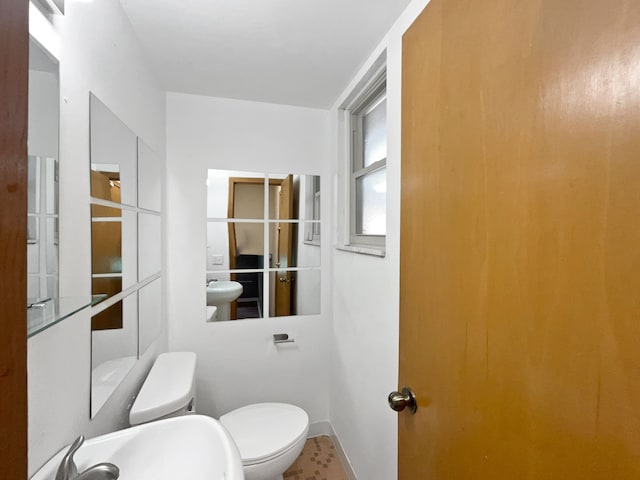 bathroom featuring sink and toilet