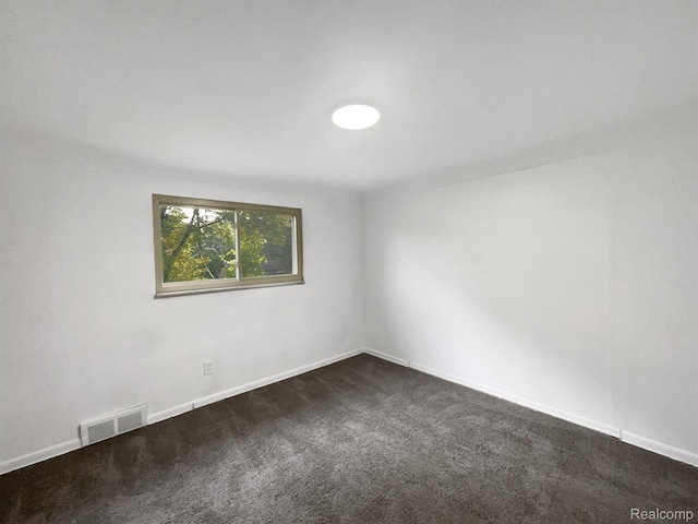 53044 Ruann Dr, Shelby Twp, MI 48316 - unfurnished room with dark carpet and baseboards