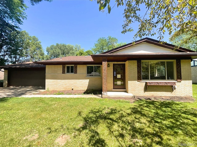 53044 Ruann Dr, Shelby Twp, MI 48316 - ranch-style house with brick siding, a front lawn, and a garage
