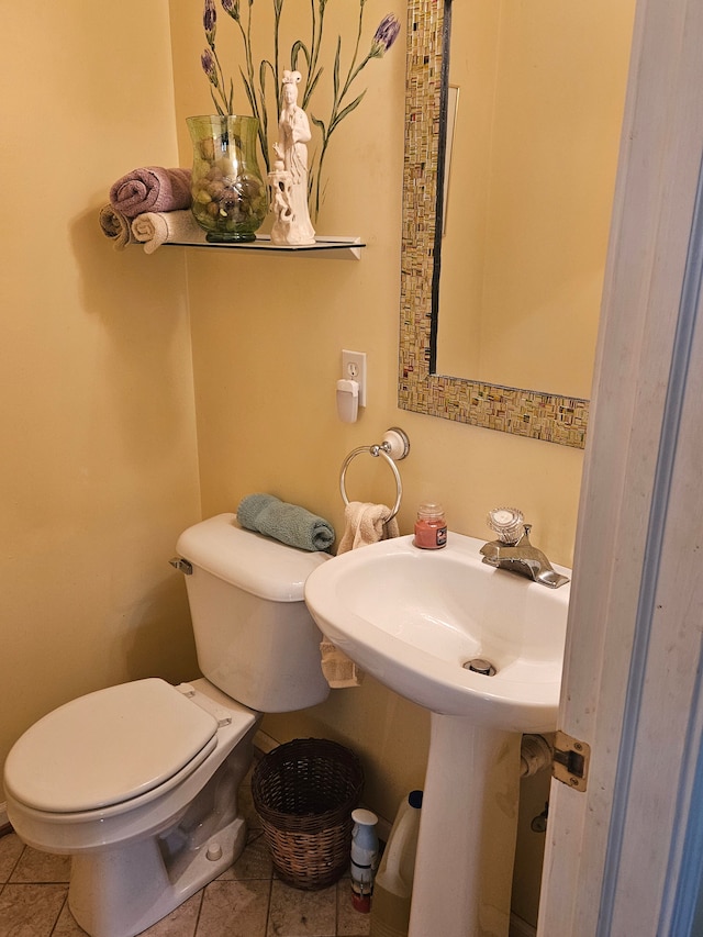 bathroom with tile patterned floors and toilet