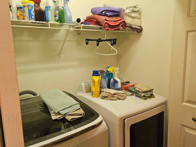 laundry area with washing machine and clothes dryer