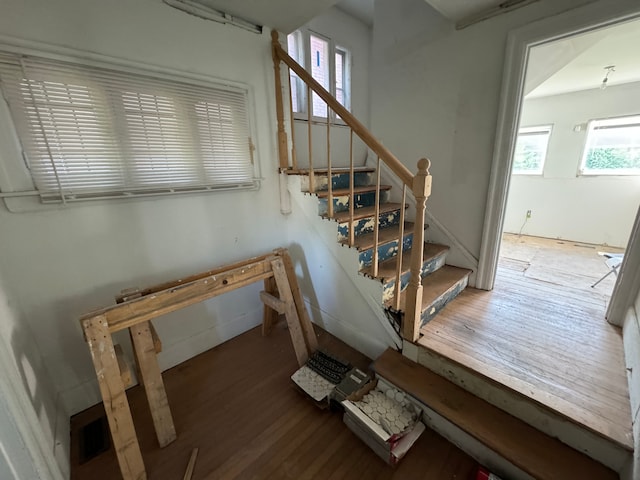 staircase featuring hardwood / wood-style floors