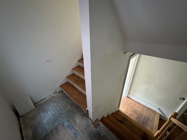 stairway with hardwood / wood-style floors