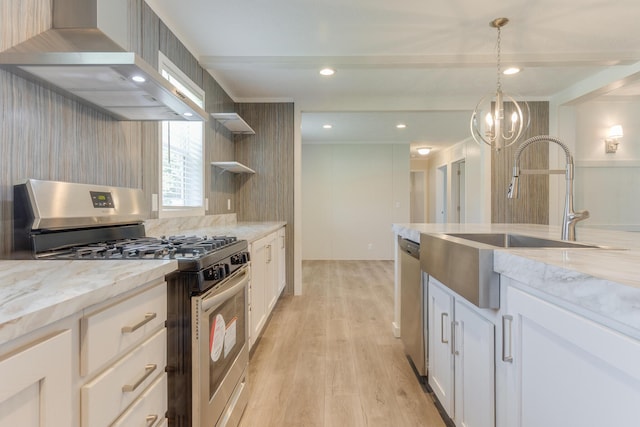714 Mill St Unit 27, Leslie, MI 49251 - kitchen with appliances with stainless steel finishes, wall chimney exhaust hood, open shelves, light wood-type flooring, and white cabinets