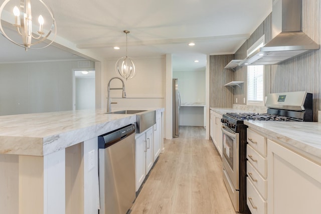 714 Mill St Unit 27, Leslie, MI 49251 - kitchen featuring appliances with stainless steel finishes, a chandelier, wall chimney range hood, a sink, and light stone countertops