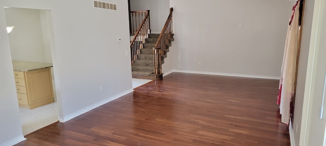 corridor featuring hardwood / wood-style flooring