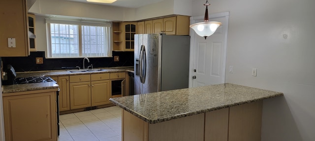 kitchen with sink, light brown cabinets, stainless steel refrigerator with ice dispenser, decorative backsplash, and light tile patterned floors