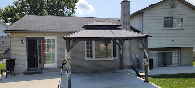 exterior space with a gazebo and a patio area