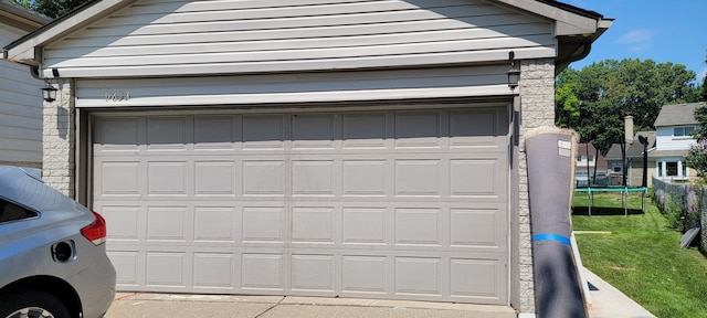 garage featuring a yard