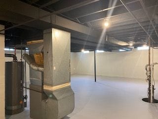 basement featuring gas water heater