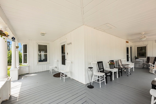 deck with ceiling fan and a porch