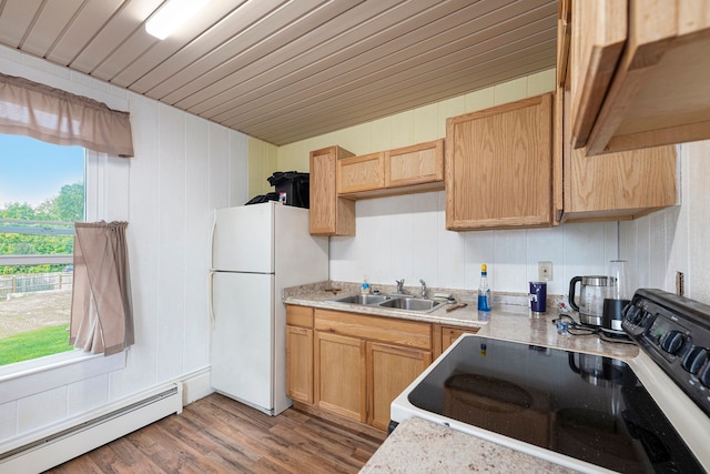 kitchen with white fridge, electric range oven, sink, light wood-type flooring, and a baseboard radiator