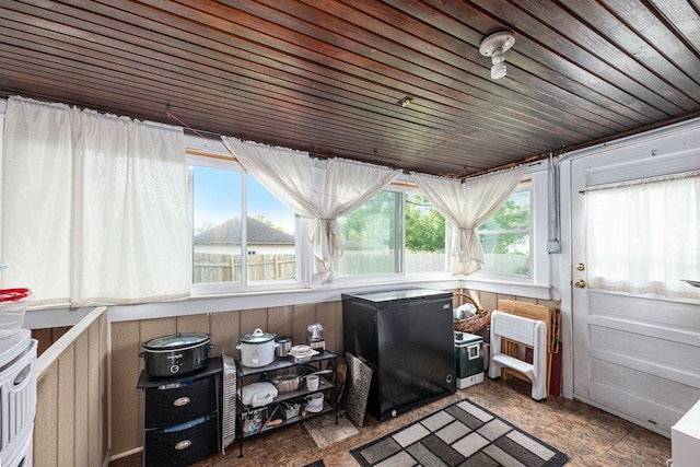 sunroom with wooden ceiling