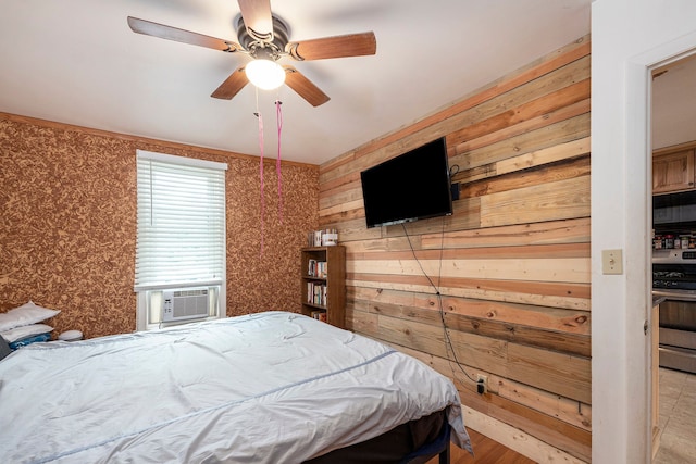 unfurnished bedroom with ceiling fan, cooling unit, and wood walls