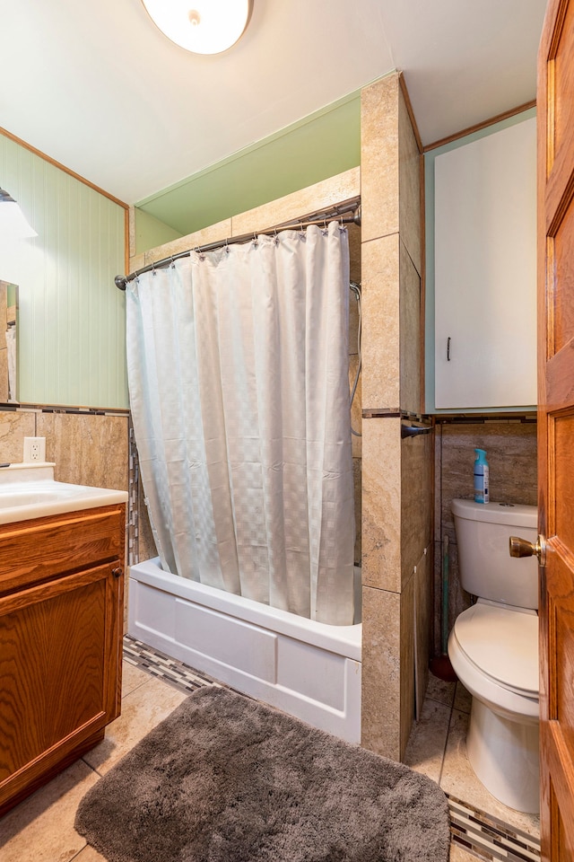 full bathroom featuring tile patterned flooring, vanity, shower / tub combo, tile walls, and toilet