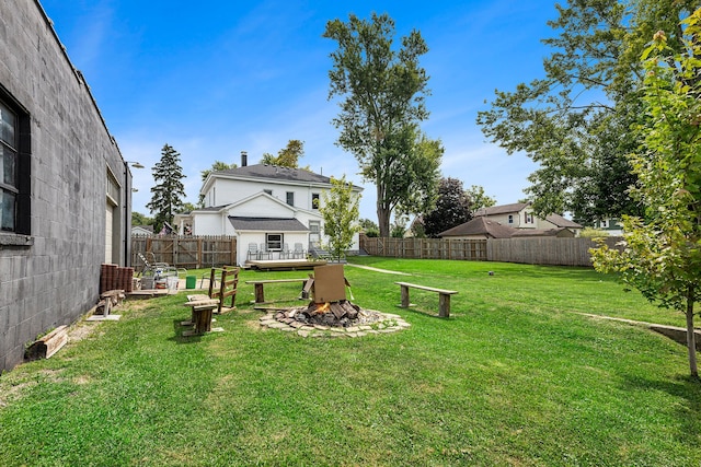 view of yard with an outdoor fire pit