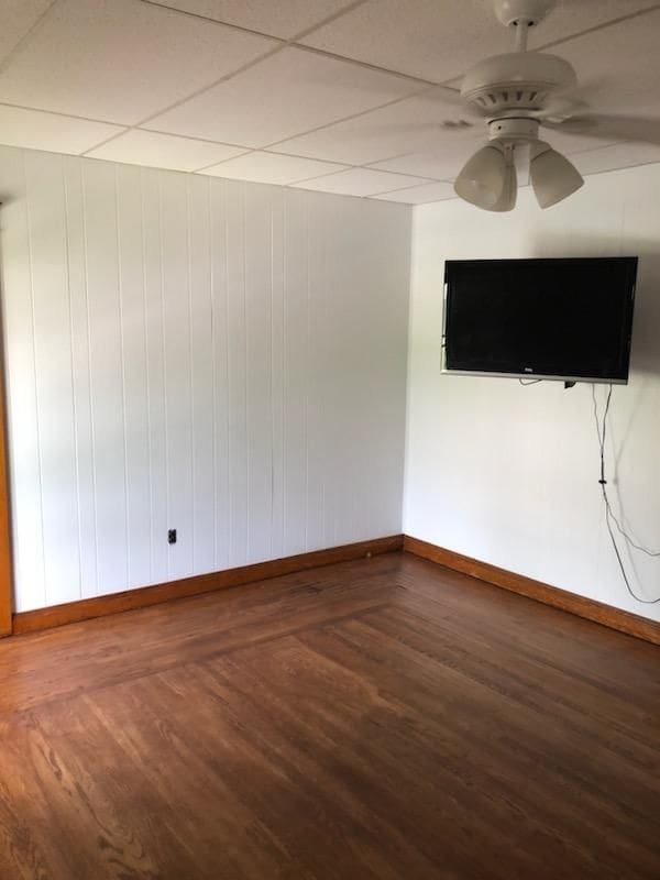 spare room with ceiling fan and hardwood / wood-style floors