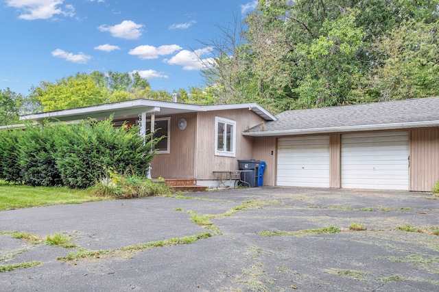 view of side of home featuring a garage