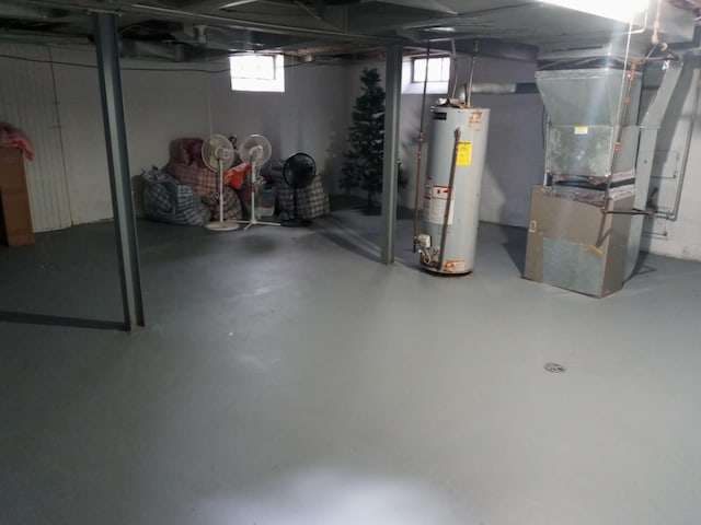 basement with gas water heater and heating unit