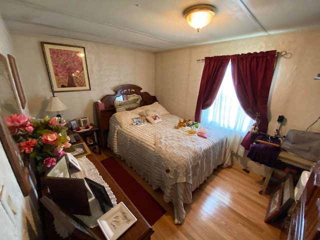 bedroom with light hardwood / wood-style flooring