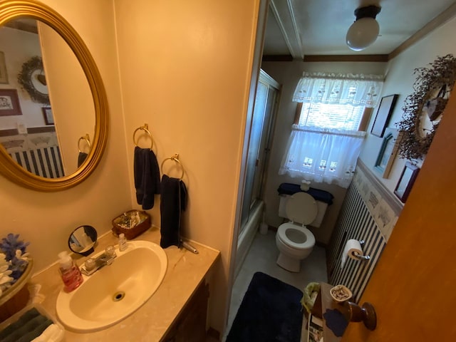 full bathroom with vanity, bath / shower combo with glass door, and toilet