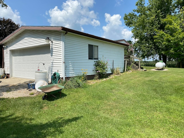 view of property exterior with a yard and a garage