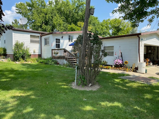 rear view of house with a yard