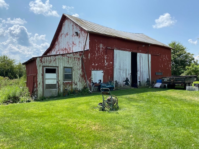 view of outdoor structure with a lawn