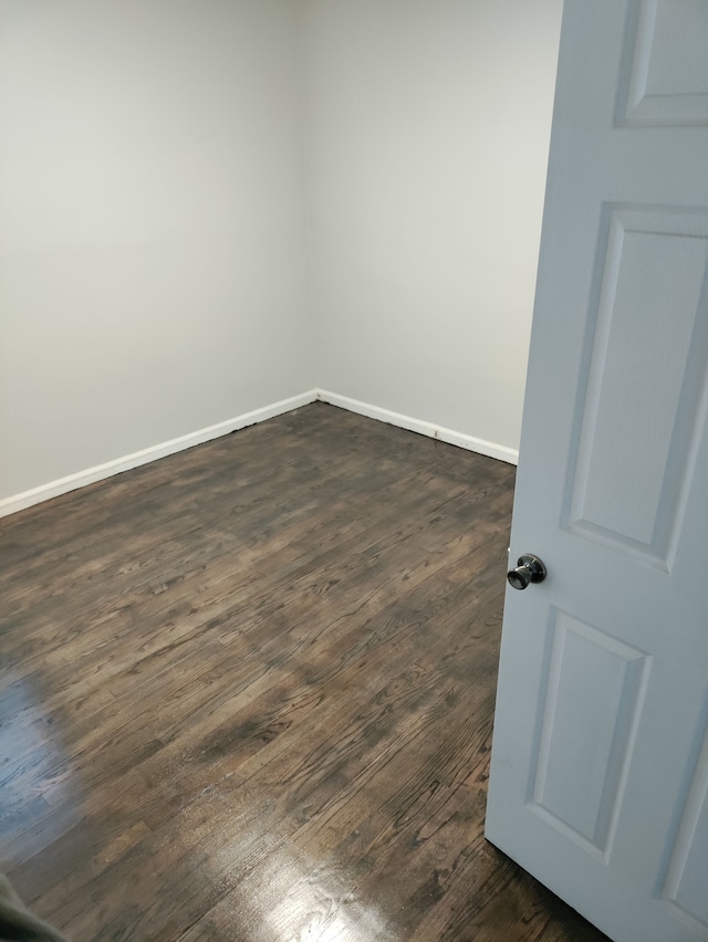 spare room featuring dark hardwood / wood-style floors