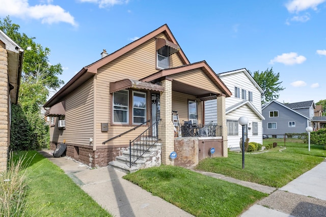 bungalow-style house with a front lawn