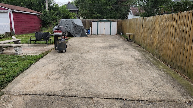 view of patio / terrace with a shed