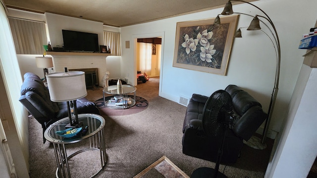 living room featuring carpet flooring and a textured ceiling