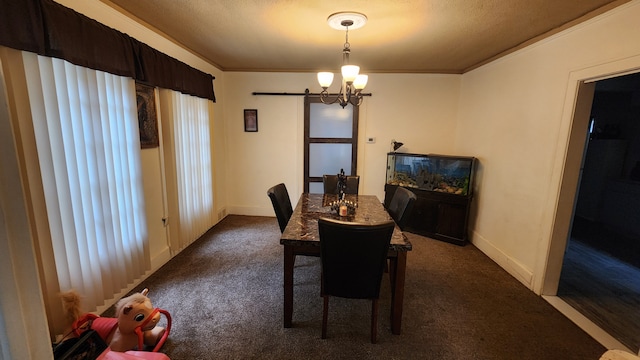 dining room with dark carpet, ornamental molding, a textured ceiling, and a chandelier