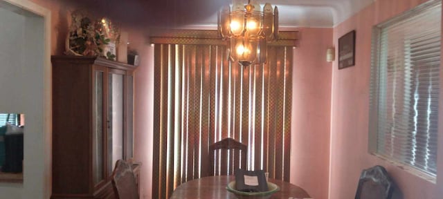 dining area featuring a chandelier