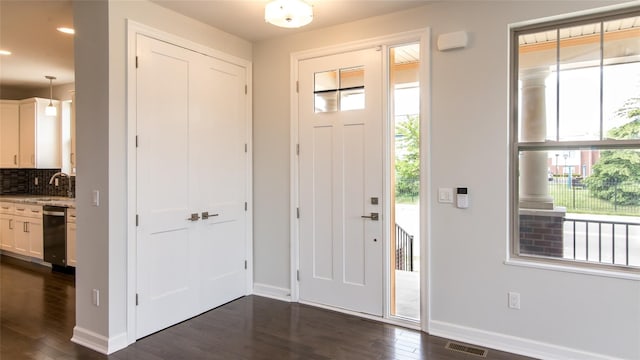 1361 W Canfield St, Detroit, MI 48208 - entrance foyer featuring baseboards, dark wood finished floors, and recessed lighting