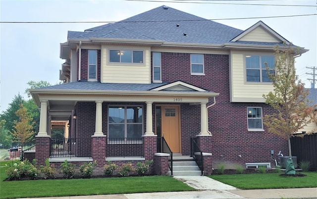 1361 W Canfield St, Detroit, MI 48208 - view of front of house with a porch, brick siding, roof with shingles, and central air condition unit